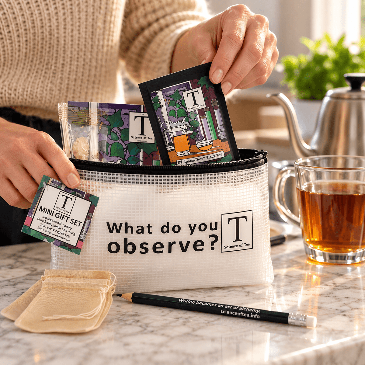 Hand taking a Space-Time Black Tea packet from the Science of Tea Travel Pouch to prepare tea